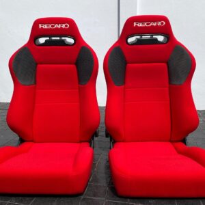 Original Recaro SR3 VF Seat showcasing vibrant red upholstery Close-up of Recaro SR3 VF Seat highlighting ergonomic design and integrated headrest Interior view of Original Recaro SR3 VF Seats installed in a performance vehicle