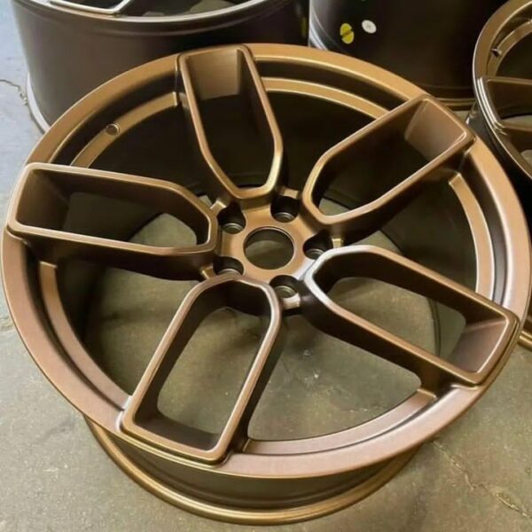 Dodge Charger with upgraded 20-inch satin bronze wheels Performance wheels with staggered fitment for Dodge vehicles