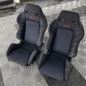 Authentic Black DC2R Type R Recaro Seats installed in Honda Integra Close-up of Recaro Type R seat design and stitching