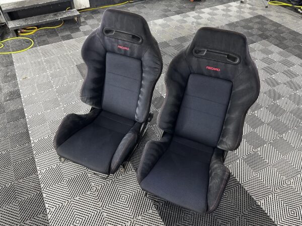 Authentic Black DC2R Type R Recaro Seats installed in Honda Integra Close-up of Recaro Type R seat design and stitching